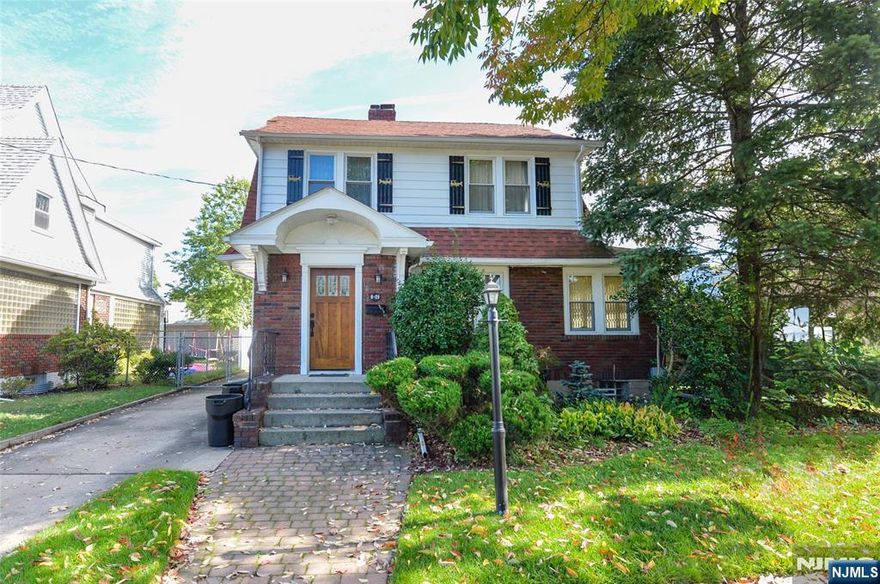 Move right into this beautifully maintained 3-bedroom, 2.5-bath home featuring timeless character and modern updates. The first floor offers a welcoming entryway, sun-filled living room, formal dining room, and an updated eat-in kitchen with stainless steel appliances, along with a convenient half bath. Original banded hardwood floors add warmth and charm throughout. Upstairs youâ€™ll find three bedrooms, a full bathroom with heated floors, and access to a walk-up attic for storage or potential expansion. The fully finished basement includes a rec room, laundry area, and an additional full bath, providing flexible living space. Outdoors, enjoy a well-kept yard with an extra lot for added space, plus a detached garage and ample parking. Ideally located just steps from elementary school and Fair Lawn High School, close to houses of worship and transportation. This move-in ready home combines comfort, functionality, and convenience in a prime location in sought after Fair Lawn.