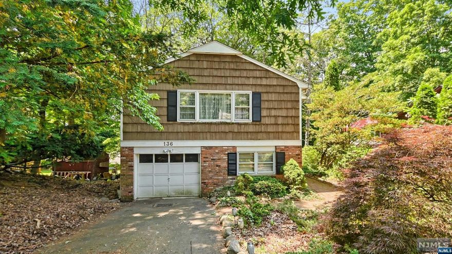 Located in the coveted section of Pines Lake which offers sailing, fishing, swimming, skating, and so much more, this is an opportunity that should not be missed. Looking for a renovation project...this is it. Looking to knock down and rebuild...this is it! Let your imagination run wild with this custom home which currently offers 3BR's, 2BA's, eat-in kitchen and a massive Living/Dining area with beautifully vaulted ceilings on the main floor. The ground floor offers BR #4, a cozy family room anchored by a brick faced fireplace, office area & sliders to the rear deck. All of this located in one of the most highly sought after communities here in North Jersey. Schedule your private tour today and let your creativity run wild!