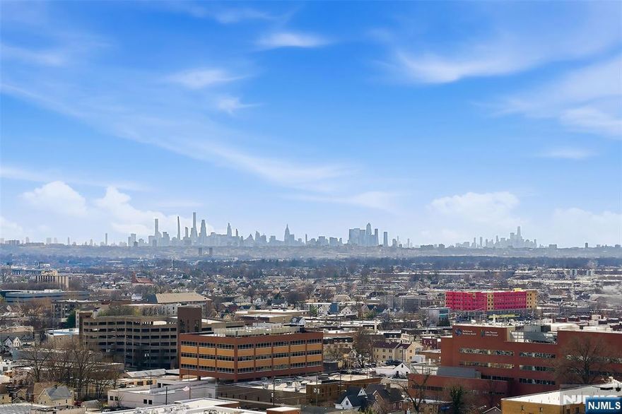 This is it! Stunning unobstructed NYC and panoramic views are yours from the terrace and all rooms of this luxury home. Located in the tallest (25 stories) and very desirable Devonshire in the heart of the prestigious Prospect Avenue high rise area. And, brightest southeast corner exposure with loads of windows/light. Appx 1464 sf includes large EIK with NEW appliances. Separate side king size 18' bedrooms & room size entry foyer. Updated flooring. 2 garage parking spaces available. General storage included. Plus a large lockable storage bin available for an add'l $75/mo. 24 hour doorman, pool, state of the art exercise gym. Steps from NYC EXPRESS bus; near NYC train, local buses and very close to HUMC medical center. Easy NYC access by car. Near all malls, shops and major highways.