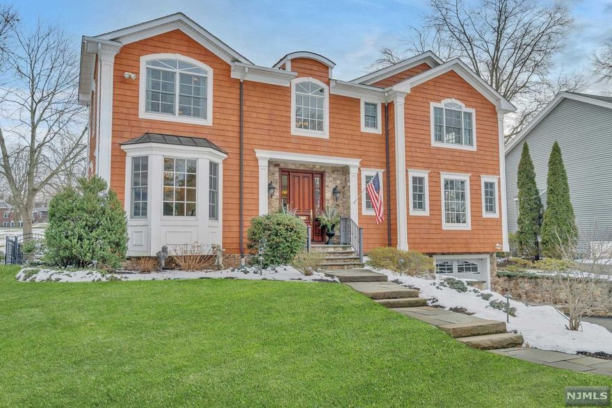 Beautifully crafted Center Hall Colonial home located on the 16th green of the Ramsey Golf and Country Club. This home was built in 2009 and designed with views of the golf course from almost every room. Open floor plan, gourmet kitchen with high end cabinets, appliances and center island. Dining room overlooks the blue stone patio with view of the golf course. Family Room has a coffered ceiling with a stone fireplace, first floor office/bedroom with full bath. The second floor boasts a Master Suite w/luxury bath and jetted tub, fireplace, and 2 walk-in closets. 2 bedrooms, (1 en-suite) full bath, and laundry room. Finished basement with powder room, garage has epoxy floors and custom cabinets, whole house generator, elevator to all levels, professional landscaping, water softner system, new paint throughout, home security w/camera system, and cul-de-sac location.