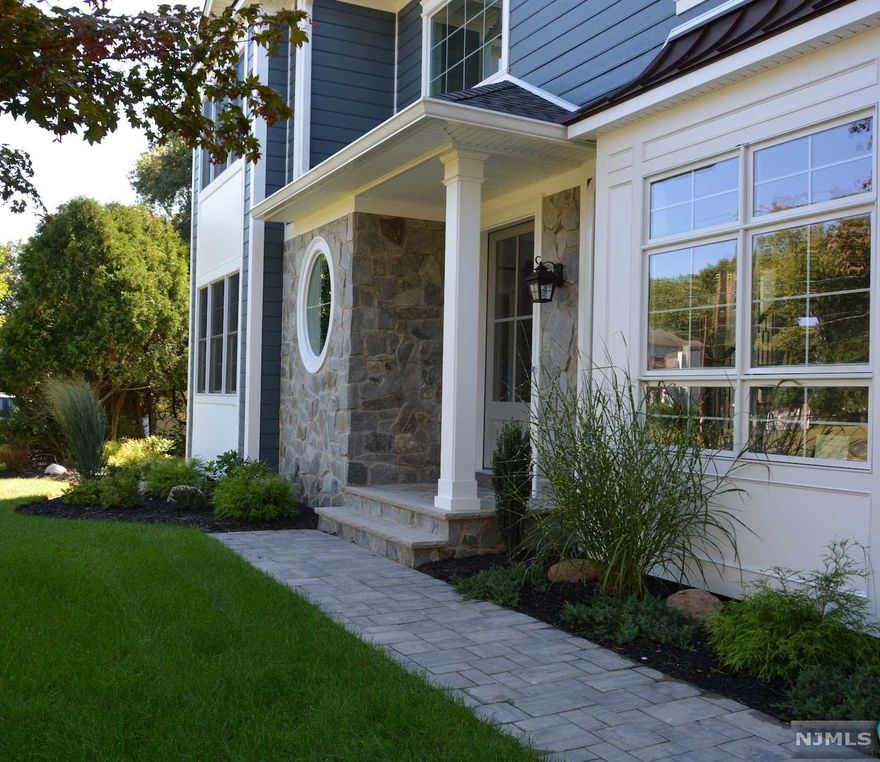 Impressive modern farmhouse colonial located in quiet and lush neighborhood. House offers open floor plan, high ceilings, Large windows, skylights. Top of the line kitchen finishes and appliances. Upgraded trim package. Heated bathroom floors. Full, finished walkout basement with commercial grade movie theater, gym, full bath and large recreation room.Covered patio with wood burning fireplace.Room for pool. Must see. Still time to add your personal touch. Photos are from previous projects done by the same builder.