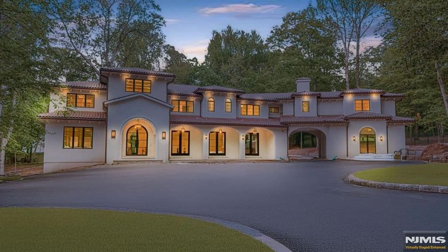 Luxury meets function in this new construction modern Mediterranean 8-bed, 9.5-bath 9,596 sq ft estate on 1.57 acres in East Hill Tenafly. Features include two 2-car garages with porte-cochere, 24-ft entry, 22-ft great room, and 10-ft ceilings throughout. All bedrooms have en suites and custom walk-in closets. Enjoy white oak floors, radiant heat, Sonos sound speakers, Lutron smart lighting, security cameras, alarm system, and full-house generator. The walk-out basement boasts a home theater, 450 sq ft designated gym area and kitchenette. Outdoors, relax by the 18x40â€™ gunite pool with spa, covered patio with electric screens, 2-way wood burning fireplace, and designer stonework.