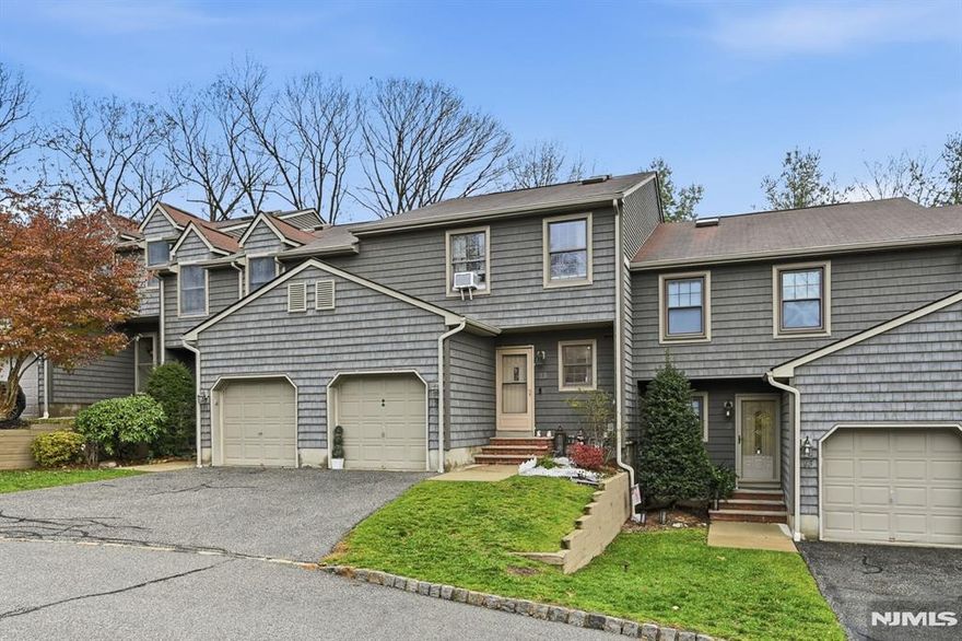 Beautiful and recently updated throughout, this 2BR/2FBA/2HBA townhome is in the desirable Mountain Ridge complex! Newly remodeled kitchen w/quartz countertops and stainless appliances, new flooring throughout the 1st floor w/dining area, light and bright living room w/fireplace, sliders to rear deck, updated half bath and convenient laundry complete this level. 2nd story boasts spacious primary suite with walk in closet and updated full bath, 2nd bedroom and updated full bath. Basement level is walk out to rear yard and has family room, half bath, storage and utilities! 1 car att garage! Nothing to do but unpack your bags and enjoy!