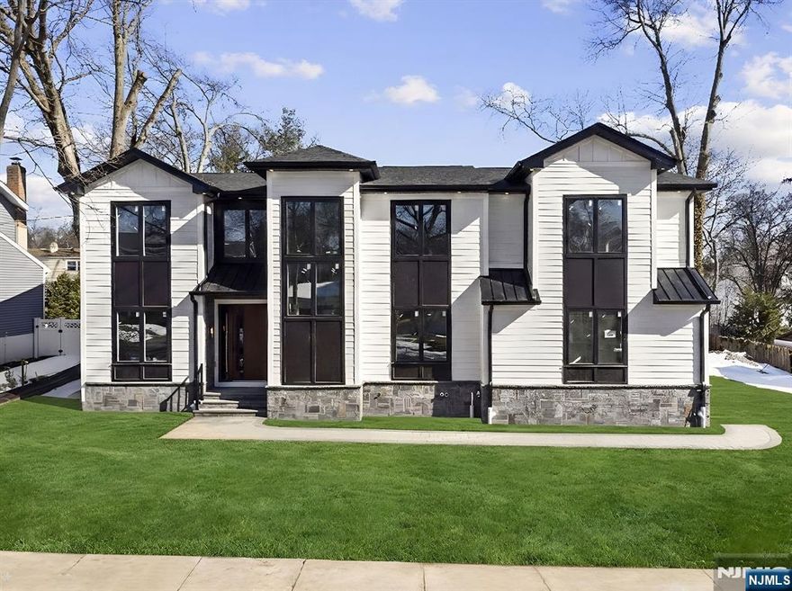 Brand-new construction on a New foundation! This stunning 6-bedroom, 5.5-bath home delivers approximately 4,900 sq ft of luxurious living space, including a fully finished basement, large driveway two car garage and over sized back yard. Step into an impressive open foyer with elegant glass railings, leading to a formal living room and separate formal dining area. The expansive family room features a cozy gas fireplace, flowing seamlessly into an updated, modern kitchen perfect for everyday living and entertaining. The first floor includes a convenient guest bedroom with its own full bath. Upstairs, discover four generously sized bedrooms, 3 Bathrooms. Highlighted by a spacious primary suite boasting two walk-in closets and a large, laundry room. The lower level offers even more versatility: a private bedroom with full bath, a large wet bar, open recreation room, and a dedicated theater spaceâ€”ideal for movie nights or game days. Move-in ready and thoughtfully designed for today's lifestyleâ€”don't miss this exceptional opportunity! This home comes with ten years builders Warranty.