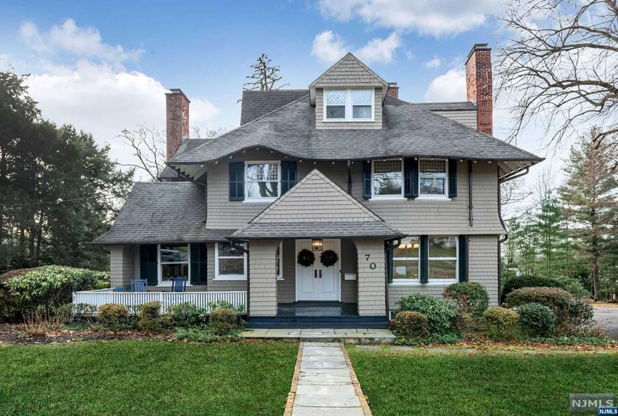 This newly renovated, timeless Colonial in desirable Ridgewood Heights sits beautifully on over one acre. The welcoming front porch leads to a dramatic entry, revealing a spacious living area with a fireplace and grand staircase. The bright, eat-in kitchen, complete with a functional butlery and coffee bar, flows into a sunlit family room with built-ins, all opening to a terrace overlooking lush grounds. Upstairs, find new hardwood floors with 4 bedrooms, including a large primary suite w/fpl & dual walk-in closets & a back staircase to Kitchen. The 3rd floor hosts a private ensuite bedroom with an alcove. The lower level caters to diverse activities, with a craft room, office, mudrm, laundry, gym, and garage access. Additionally, a detached 2-car garage with a loft offers extra space. Minutes from the commuter train and a vibrant town center with fine dining and shopping, this home is a perfect blend of comfort & convenience.