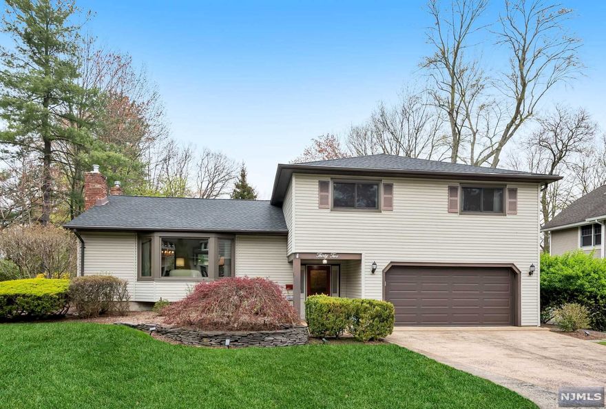 Location location! Watch the 4th of July fireworks from your back deck & enjoy the best of summer living with Crestwood lake in your backyard. Impeccably maintained with an open floor plan, hardwood floors under the carpets & an updated kitchen. Four generous bedrooms upstairs including a private primary suite. Recent updates include a new generator, windows, deck, gutter guards & more. Freshly painted throughout. Just steps from all 3 top-rated schools, shops, restaurants & NYC train. The perfect spot.