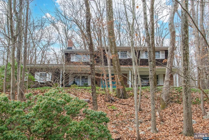 Perched upon a 1.73AC this solid 4BR, 2.1 bath colonial has only had one owner! Terrific layout, close to North Gate access in the tranquil Smoke Rise Club community. Hardwood floors under carpets! Kitchen with separate dinette. Laundry on first level. Family room has wood burning FPL & french doors to backyard. Furnace & new liner & FPL liners installed 10/2021. Front porch & paver patio. Propane tank for gas cooktop & dryer. Central AC upstairs on BR level. Large unfinished basement for great storage plus adjacent accessible crawl space. Come put your stamp on this beautiful home!