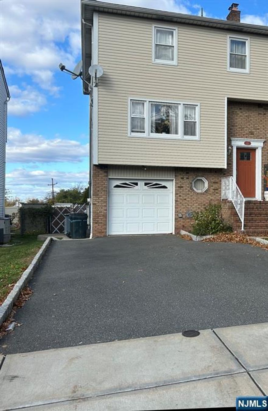 Charming, move-in ready half duplex. Home is in great condition, well loved and taken care of by the owners. Located in desirable Elmwood Park, in walking distance to schools, parks, shops, and bus stops to NYC. The home boasts 4 bedrooms and 3.5 bathrooms. First floor has a large living room with an open floor plan to the formal dining room, directly off of the well sized, eat-in-kitchen. A half bathroom on the first floor saves a trip to your private second floor bathrooms and bedrooms. Second floor boasts a large primary bedroom with primary bathroom, as well as 2 nice sized bedrooms and another full bathroom. The pull down attic access on the second floor is great for extra storage! A full finished ground floor has the final bedroom, full bathroom, along with a "summer kitchen" and glass sliding door access to the custom built oversized rear patio. The one car attached garage has the washer and dryer hook up with access to the ground level. With a four car driveway, parking is a breeze! The large backyard is great for entertaining or quiet relaxation. The rear yard also has a large shed, great for extra storage. Don't miss out on this opportunity!