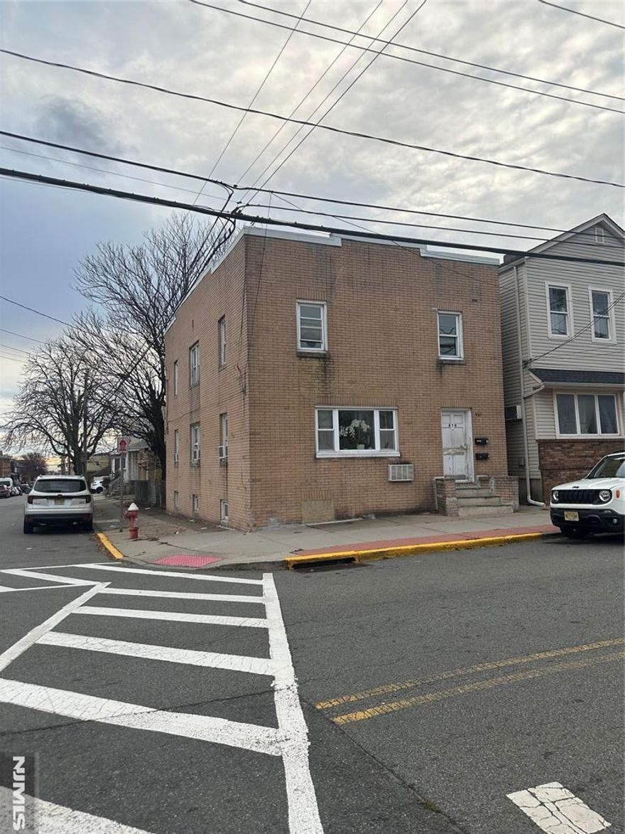 CASH ONLY. NO ACCESS TO HOME. DO NOT approach the property! Sold strictly AS-IS. Fantastic investment opportunity! Well-located true two-family home with 5 total bedrooms, 3 full bathrooms, separate utilities & hot water heaters, large spacious units, detached 2-car garage, and a partially finished basement for bonus space or storage. Prime location with easy access to NYC transportation, shopping, schools, and all amenities. Ideal for owner-occupants (live in one unit, rent the other) or investors seeking strong rental income from both units.