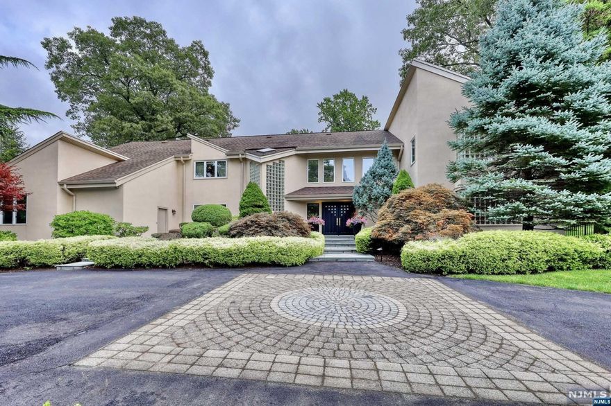 Rio Vista Dream! Come see this beautiful, sprawling, 6 bedroom, 6 1/2 bath home situated in one of the most prestigious and gorgeous locations in Cresskill! Elegant and luxurious, this home opens to a breathtaking, sun drenched, open expanse of Foyer, Living Room and Dining Room, with a stunning double fireplace, beautiful white Kitchen, and Breakfast Room! Massive windows and high ceilings light up the fabulous rooms and highlight the exquisite property! An elegant, wood paneled Library, En-Suite First Floor Bedroom, Powder Room, and a Full Bath, opening to an opulent acre + of stunning, completely private grounds, patio, and pool! Upstairs, the grand foyer leads to a splendid MBS w Fireplace, and spa like bath. Another, lovely large Bedroom, en-suite,2 more lg bedrooms w a Jack & Jill BR, & an office/5th bedroom. A Fully finished basement offers, wine cellar, theater, gym & game areas, FB + Bonus Room! Dreams do come true, mint-move-in-luxury awaits you in this beautiful home!