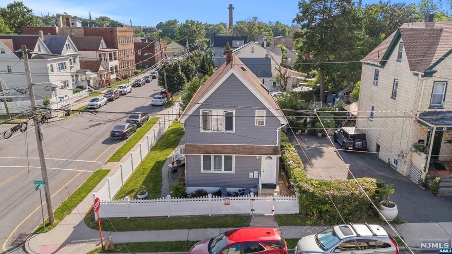 WELCOME TO THIS BEAUTIFUL 2- FAMILY HOME IN THE HEART OF GARFIELD WHICH OFFERS THE FOLLOWING: 1ST FLOOR BOASTS A SPACIOUS LIVING AND DINING ROOM SPACE,WITH 2 BRS AND 1 FULL BATH. THE 2ND FLOOR OFFERS MODERN LIVING AND DINING ROOM SPACE, 3 BRS AND 1 FULL BATH. IT HAS A FINISHED BASEMENT WITH A FAMILY ROOM, 1 FULL BATH AND LAUNDRY ROOM. THIS PROPERTY ALSO INCLUDES WELL-MAINTAINED FENCED YARD WHERE YOU CAN ALSO ENJOY THE OUTDOORS IN A METICULOUSLY KEPT LAWN IDEAL FOR RELAXATION,RECREATION AND GARDENING. FINALLY, IT HAS CONVENIENT 1-CAR GARAGE PLUS ADDITIONAL PARKING FOR 3 CARS. STRATEGICALLY LOCATED CLOSE TO SHOPPING CENTERS, SCHOOLS, PARKS, NY TRANSPORTATION AND MAJOR HIGHWAYS. WHETHER YOU'RE LOOKING TO INVEST OR FIND A NEW PLACE TO CALL HOME, THIS TWO-FAMILY IS A FANTASTIC OPPORTUNITY. DON'T MISS OUT THIS GEM ! CALL TODAY TO SCHEDULE A PRIVATE SHOWING !