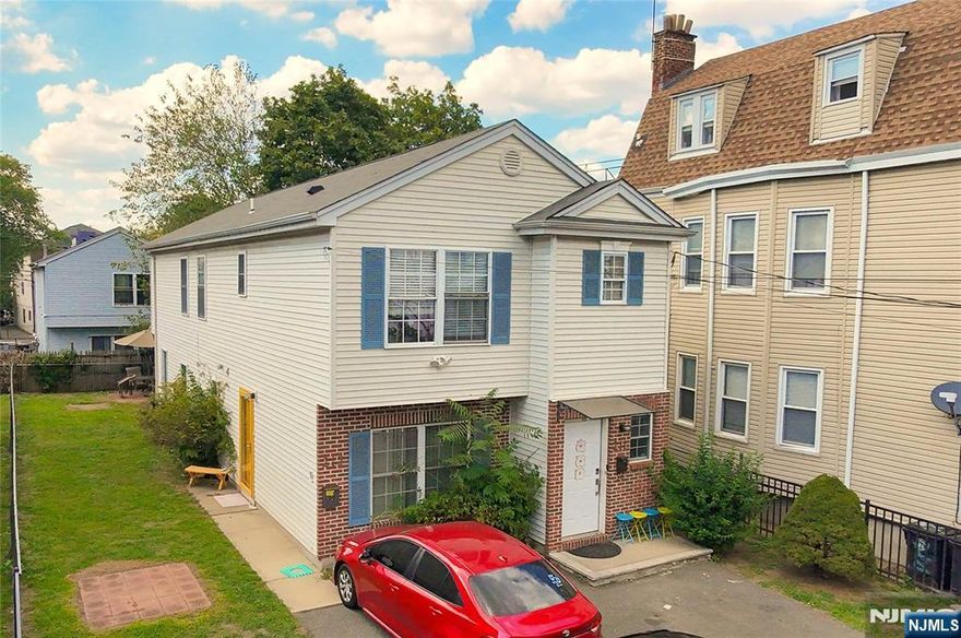 Welcome to this charming two-family home built in 2003, offering the perfect blend of modern comfort and investment potential.The first-floor is a two bedroom unit, with recently updated flooring and elegant granite countertops in the kitchen for a sleek and polished look. The second-floor unit features the same updated flooring throughout and granite countertops in the kitchen. Additionally the 2nd floor offers a total of three bedrooms and two baths, with the inclusion of its primary suite. Both units offer central air and laundry in unit. There is parking on the driveway for 4 vehicles and the yard is securely fenced in.Well maintained and in excellent condition, this home stands out in the neighborhood as a newer construction house. Conveniently located with easy access to local amenities, schools, and transportation, itâ€™s a fantastic opportunity for both homeowners and investors alike.