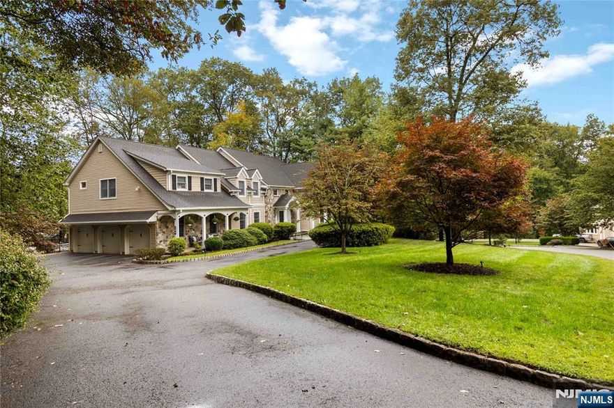 **Country Charm Meets Modern Elegance** Stunning Ctr Hall Colonial w/timeless stone & beige siding feels like a decoratorâ€™s showhouseâ€”blending refined updates w/modern comfort. Enter the grand 2-story foyer w/drop-down chandelier & notice the details. Gleaming Hardwood floors throughout. Chefâ€™s KIT boasts quartz island, hammered granite counters, Viking 6-burner stove, Sub-Zero, pot filler, MW drawer, custom cabs w/spice racks & filtered sink water. Sunlit dining area opens to deck for indoor/outdoor living. Formal DR w/wainscoting & chandelier, Fam Rm soaring 2-story FR w/Palladian windows & stone FP, plus library/office w/built-ins & bar. 1st-fl BR w/outdoor access ideal for guests. Upstairs, the Primary Suite offers FP, 2 cedar + large walk in closets & spa-like BA w/Porcelanosa marble & chrome finishes. Addâ€™l BRs feature spacious closets, updated BAs & Restoration Hardware touches. Fabulous walk-out BSMT incl wet bar w/quartz island & bev center, media area, gym w/mirrored wall & barn door, office, storage & stylish Porcelanosa BA. Outdoors: heated pool w/jetted sitting area, b-ball area, pergola-covered deck & landscaped grounds w/sprinklers. Extras: 3-car gar, multi-zone A/C, 7-zone heat, newer roof (4 yrs), HWH (6 yrs), septic serviced, generator hook-up, alarm, Ring cameras & central vac. This is **Franklin Lakes living at its bestâ€”luxury, comfort & timeless style!**