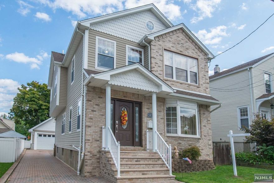 Great pride of ownership shows throughout this beautifully renovated 4 bedroom 2 full & 2 half bath Custom Colonial! Reno in 2003. Nothing to do, just move right in! The first level features a very spacious living room with built-in entertainment center and a gas fireplace. The gourmet eat-in kitchen is off of the formal dining room and offers granite counters, center island, double oven, SS appliances & a custom granite kitchen table. The sliders off of the kitchen lead to a beautiful upper & lower paver patio. Also on the main level is a mudroom from the rear entrance, powder room and a bar area off of the kitchen. The second level features the Primary Suite which offers WIC, a large bath that includes a jetted tub, double vanity & shower. 3 Additional generous size bedrooms, the main bathroom and laundry room are also on the 2nd level. Other features include beautiful wood floors throughout, two car detached garage, finished basement, paver driveway, maintenance free backyard.