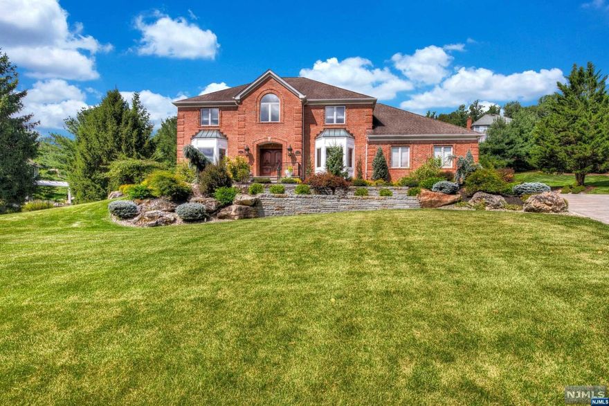 This truly exceptional home is a beautiful synthesis of modern luxury and architectural sophistication, classic elegance, all with a wonderfully comfortable ambience. Set in a prime Morris County neighborhood, its captivating curb appeal is accented by stunning millwork and thoughtful details where natural light floods the home on every level. No expense was spared in the top to bottom transformation in creating the ultimate lifestyle. With its exceptionally private location at the cul-de-sac. Beautiful custom built kitchen with center island, Sub-Zero refrigerator/freezer, WOLF range and radiant heat.First floor also includes wood paneled library, family room with FPL, built-ins and wall of windows overlooking trex deck. The second floor features four bedrooms,including beautiful primary suite with luxurious spa-like bathroom and custom closet. The lower level is complete with family room, play room, kitchenette. Beautiful landscaping,new bluestone walkway&lighting,new drivway.