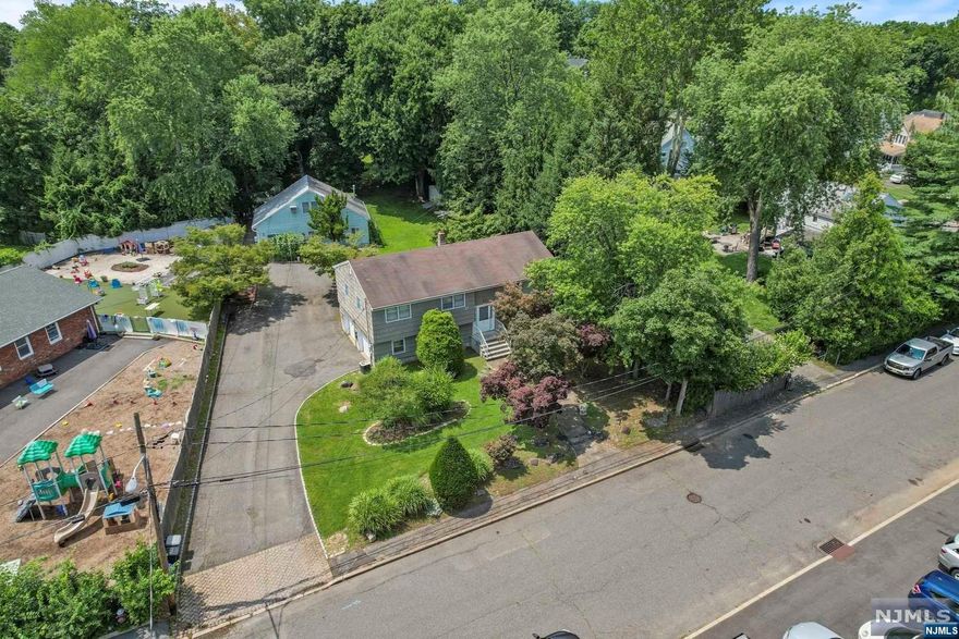 In the heart of Closter, off Closter Dock Road, sits this gem. 18 William Street houses a 3-BR Bi-Level house with a floor plan conducive to easy living and a two car attached garage, a 2-story accessory structure perfect for a man/woman cave or office, and a large beautiful mature landscaped backyard. This 3/4 acre is zoned Residential B, giving potential for development. This is a must see for INVESTORS, TRADES, or those looking for a home for FAMILY or EXTENDED FAMILY. Priced to sell as is.