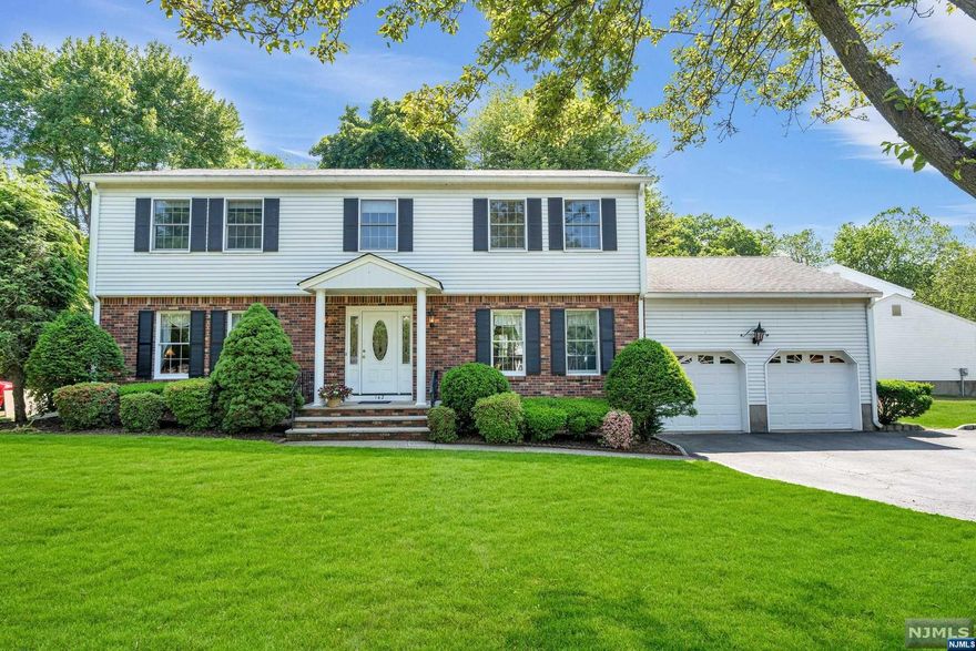 Welcome to 142 Emerald Court, a GEM of a home nestled on a quiet cul-de-sac on the NW side of Paramus. This Center Hall Colonial has been lovingly maintained by its original owner. The property embodies the perfect blend of timeless charm and versatile living spaces. The generous layout allows for entertaining in the living and dining areas, as well as a casual gathering room with fireplace and sizable eat-in kitchen with plenty of potential. Adjacent to the kitchen is a bonus room, equipped for an additional bedroom or home office/playroom. The second floor features four large bedrooms, including a primary suite and a second main bathroom. A huge finished basement is waiting for your creative vision and the possibilities are endless. A beautiful Trex deck compliments the fenced yard permitting alfresco dining, sunbathing or just relaxing. Close to retail, schools, parks and transportation. Schedule your tour today!