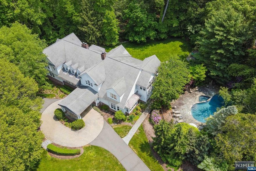 CUSTOM CENTER HALL COLONIAL DESIGNED BY JAMES PARAGANO SITUATED ON 1.5 ACRES OF RESORT LIKE PROPERTY, FEATURING 7 BEDROOMS, 7 FULL AND TWO HALF BATHS. AMAZING FLOOR PLAN FOR EVERYDAY LIVING AND ENTERTAINING FEATURING HIGH CEILINGS ON ALL THREE LEVELS, SUN-FILLED OVERSIZED ROOMS, ARCHITECTURAL ENHANCEMENTS THROUGHOUT, LARGE CHEF'S KITCHEN WITH BREAKFAST ROOM, LIBRARY WITH COFFERED CEILING AND WET BAR, FAMILY ROOM WITH BUILT-IN CABINETRY, 1ST FLOOR ENSUITE GUEST ROOM, HOTEL STYLE PRIMARY SUITE W/BEAUTIFUL BATH W/RADIANT HEAT, 4 ADDITIONAL ENSUITE BEDROOMS, SECONDARY STAIRCASE AND EXPANSIVE LOWER LEVEL. FABULOUS OUTDOOR OASIS FOR ENTERTAINING, LARGE PATIO WITH BUILT-IN INDUSTRIAL BBQ, HEATED POOL & SPA, GORGEOUS LANDSCAPING, SPRAWLING LAWN, 3 CAR GARAGE, FULL HOUSE GENERATOR, MULTIPLE ZONES OF HEAT & A/C AND SECURITY/CAMERA SYSTEM. BLUE RIBBON SCHOOLS & CLOSE TO MANHATTAN!