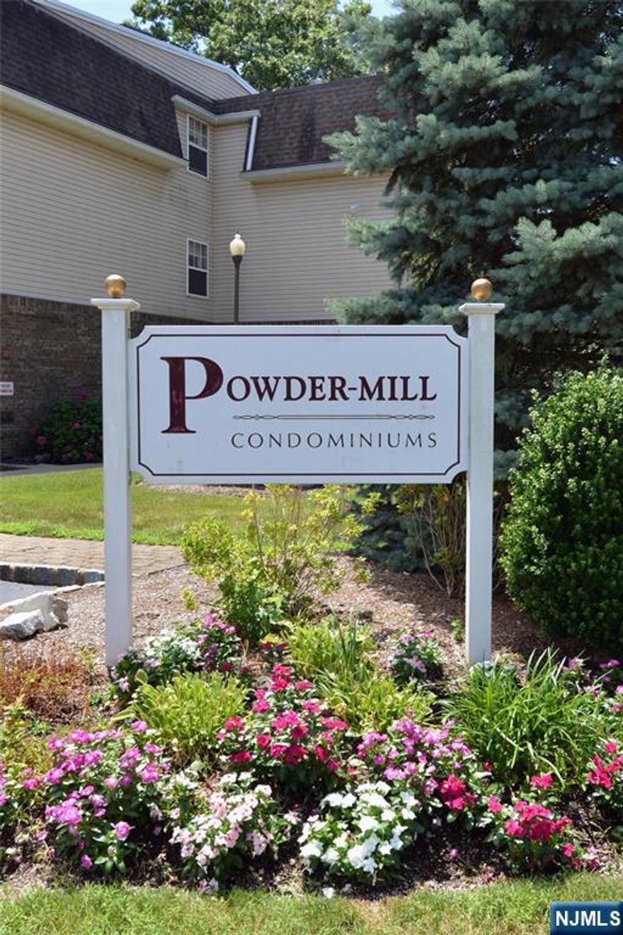 Embrace one floor living at it's best in sought-after Powder Mill, an affordable adult 55+ community in Riverdale. One of the largest in the development, boasting over 1300 sq. ft, this top floor condo is as immaculate as it is inviting with an especially coveted courtyard location overlooking the pool. The open floor plan features an eat-in kitchen with plentiful cabinetry and stainless appliances, formal dining room with crown molding and rare pantry closet, spacious living room with crown molding and sliders to a covered deck, making it the perfect shaded retreat. The primary bedroom includes an ensuite bath and two double closets while the second bedroom provides additional space as an ideal guest room, den or office. To complete the unit, there is an additional full bath and convenient laundry closet with stackable washer/dryer just two years old. Other features include wide planked laminate flooring throughout, three year old central air/furnace, basement storage unit, elevator and assigned parking space directly in front of the building. Powder Mill is a wonderfully welcoming community with clubhouse activities, in-ground pool, low taxes and low maintenance fees which include water and sewer. Discover adult living at its most enjoyable and effortless when you make this special home YOURS!
