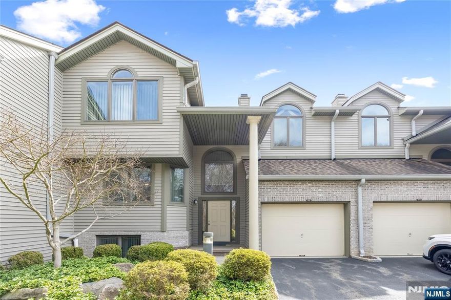 Step into this desirable Northwoods townhouse offering a spacious, well designed layout across three levels of comfortable living. The ground level features a versatile family room, a private bedroom, kitchen and a full bathâ€”an ideal setup for guests, extended family, or a dedicated home office. The main floor welcomes you with an inviting entry foyer and convenient access to the garage. The bright living room with a fireplace, flows seamlessly into the dining room, a large eat in kitchen and powder room. Sliding doors lead to a private deck, perfect for outdoor dining or relaxing. The top floor offers a spacious primary en suite with generous closet space, an additional bedroom, and a full hall bath, providing comfort and privacy for all. There is also a laundry room that complete the top floor. This Northwoods townhouse combines functionality, comfort, and a great locationâ€”an excellent opportunity for buyers seeking space and convenience in a well maintained community.