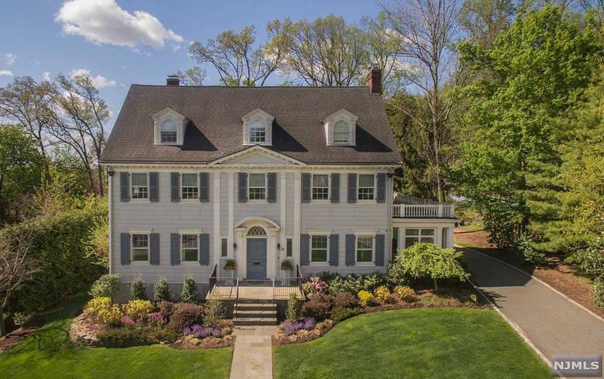 The Best Of Montclair Living. Warm sophistication & simple elegance rule in this center hall Colonial. The perfect place to live, play & work! Exquisitely renovated to the highest standards with meticulous attention to detail, mixing classic & modern elements for today's buyers. This 7 BR/3.2 BA home w/ abundant natural light throughout the inviting floor plan has stunning moldings, 10 foot ceilings & high-end kitchen leading to relaxing family room w/custom built-ins. The serene primary suite has impressive dressing room & spa like bath. Stunning finished lower level offers a spacious & comfortable screening area, wet bar & built-in work stations! Outdoor living at its finest w/ a two-tiered stone patio & a private, lush landscaped yard. Easy access to NYC train. AWARD WINNING DOWNTOWN AREA nearby!