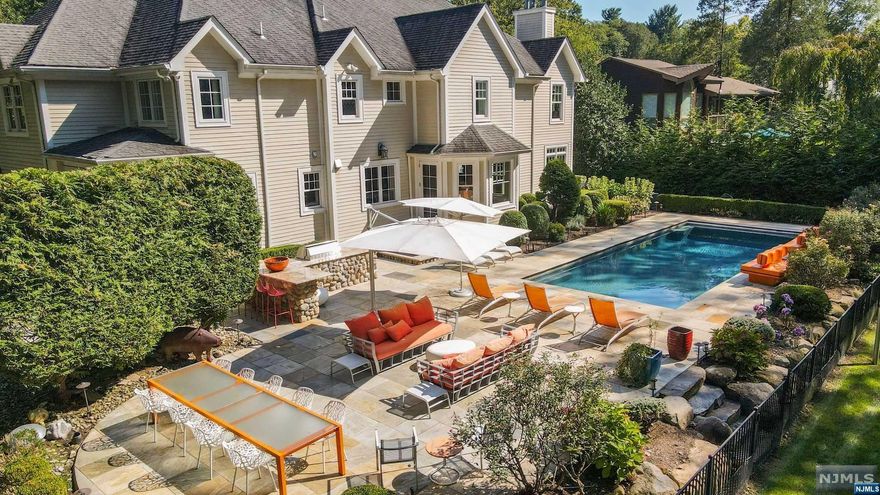 OPEN HOUSE HAS BEEN CANCELLED!!! THIS BEAUTIFULLY DESIGNED HAMPTONS STYLE HOME WAS CUSTOM BUILT IN 2006 AND BACKS UP TO ACRES OF TOWN PROTECTED WOODLANDS. RESORT STYLE LIVING IN THE STUNNING BACKYARD WITH LARGE STONE TERRACE, HEATED GUNITE POOL W/AUTOMATIC COVER, OUTDOOR KITCHEN AND MULTIPLE ENTERTAINING AREAS. 1ST FLOOR FEATURES: LARGE GOURMET KITCHEN W/HIGH END STAINLESS STEEL APPLIANCES, BREAKFAST RM OVERLOOKING POOL, BUTLER'S PANTRY W/WINE REFRIG, LARGE DINING ROOM, SUNKEN FAMILY ROOM W/FPL, OFFICE W/FPL, MUDROOM/LAUNDRY ROOM, AND 2 PWDR RMS. LUXURIOUS PRIMARY SUITE HAS A GAS FIREPLACE, TRAY CEILINGS, 2 WALK IN CLOSETS, SPA LIKE BATH W/RADIANT HEAT, TWO VANITIES, JACUZZI TUB AND STEAM SHOWER. 3 ADDTL EN-SUITE BEDROOMS. FINISHED BASEMENT W/MIRRORED GYM, BONUS ROOM, FULL BATH, MEDIA ROOM AND GAME ROOM. 3 CAR HEATED GARAGE, GENERATOR. IN CLOSE PROXIMITY TO SCHOOL, TOWN, SHOPS, TENNIS, LIBRARY AND NYC BUS. BLUE RIBBON SCHOOL DISTRICT.