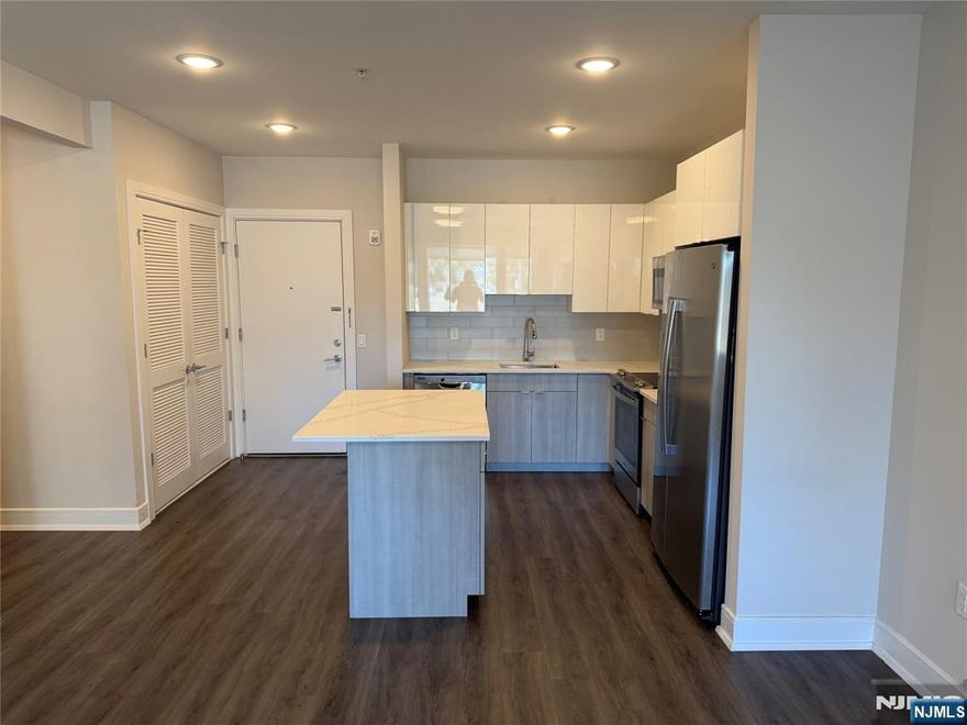 **FIRST MONTH FREE on a 13-month lease + one parking space included! - for occupancy commencing on or before 2/1/26!** Welcome to the Metro, Fort Lee's newest luxury building. All amenities INCLUDED in the rent, and REDUCED rent security offered to qualified applicants - The Metro features a variety of upscale, spacious floorplans. high-end residences fully equipped w/ modern kitchens w/ stainless steel appliances, quartz countertops, full islands & tiled backsplashes, open living/dining areas, shades on all windows, modern bathrooms & a full-sized washer & dryer in each unit. The Metro features a large elegant lobby, outdoor courtyard, outdoor terrace/garden, large club room and a on-site fitness center, which includes the Echelon Reflect mirror, electric car charging stations & INDOOR (covered) parking garage w/ direct elevator access to all residences for uncompromising security. Pet friendly (LB limit & fees apply)! Tenants pay ALL utilities! PARKING: 1st space INCLUDED IN THE RENT(!); Additional space - $150/monthly! Virtual tour available upon request!