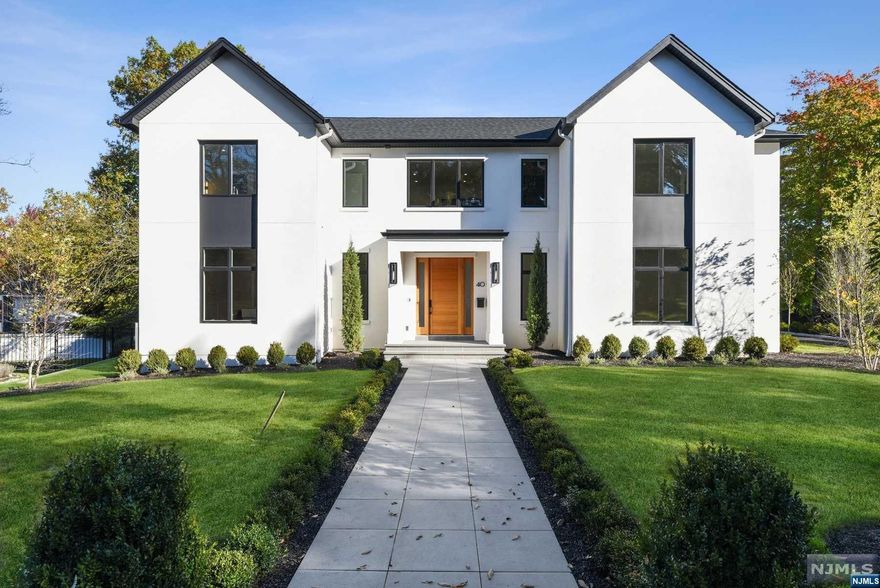 Welcome to your dream home set on an oversized lot on the upper North side of Englewood Cliffs. This newly constructed 6-bed, 7-full/2-half bath residence is a blend of contemporary elegance and architectural design. Step outside and experience true tranquility on the covered porch, complete with a built-in grill and cabana bath, overlooking a spectacular saltwater pool and spa, surrounded by a beautifully landscaped yard. The main level opens up to a world of modern luxury, where the gourmet kitchen, dining room, and great room blend harmoniously. With a private office, guest suite, and a powder room, this level is designed for both entertaining and practicality. The second floor features an open family room, primary bedroom suite, 3 additional bedroom suites and a laundry room. The finished lower level includes: recreation rooms, gym, bedroom suite and guest powder room. High ceilings, extensive radiant heat, 5" white oak flooring, transitional finishes. Ready for Occupancy!