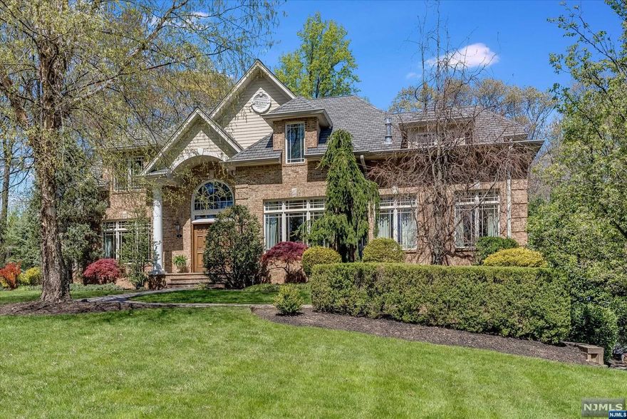 This stunning brick CH colonial. Perfectly situated at the end of a quiet street, this home embodies a modern luxury while maintaining the traditional style of colonial architecture. The soaring 2 story entry foyer features crown moldings and beautiful bordered hardwood floors throughout the home. Every room has a view, allowing you to enjoy the quiet serenity of your surroundings. The first floor includes a parlor, Living rm, dining rm, butlers pantry, powder room, Laundry rm, bedroom with ensuite and private office.. The gourmet kitchen with top-of-the-line appliances, custom cabinetry, and a center island with seating. The Family rm features a 2 story stone wood burning fireplace and sliding doors to an amazing back patio with a luxurious hot tub, heated pergola, perfect for al fresco dining and entertaining. The 2nd floor includes grand primary suite which including a gas fireplace sitting rm, large closets and a spa like bathroom.There are also 2 more bedrooms and hall bath.