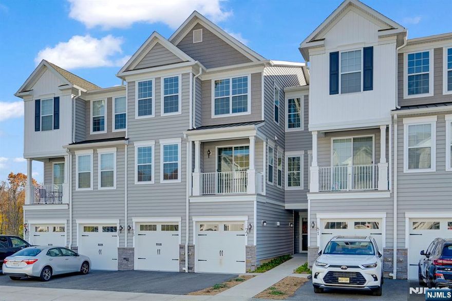 Welcome to the highly coveted Yale model in the breathtaking Hilltop at Cedar Grove! Built less than five years ago, this immaculate townhome offers the perfect blend of style and sophistication. The gourmet kitchen features stainless steel appliances, granite countertops, and an open-concept layout that flows seamlessly into the bright living and dining areas with high ceilings. The main level showcases luxurious vinyl plank flooring, a large pantry/storage closet, powder room, and a private balcony ideal for morning coffee or evening sunsets. Upstairs, discover FOUR spacious bedrooms, including a serene primary suite with a spa-like bath and expansive walk-in closet. The additional three bedrooms are generous in size, complemented by a bright loft area, full bath, laundry room, and oversized storage closet. Professionally painted just days ago and beautifully finished with custom lighting. Enjoy a one-car garage, driveway parking, and resort-style amenities clubhouse, infinity-edge pool, fitness center, BBQ areas, and shuttle to Upper Montclair Train Station all moments from shopping, parks, dining, and major highways.