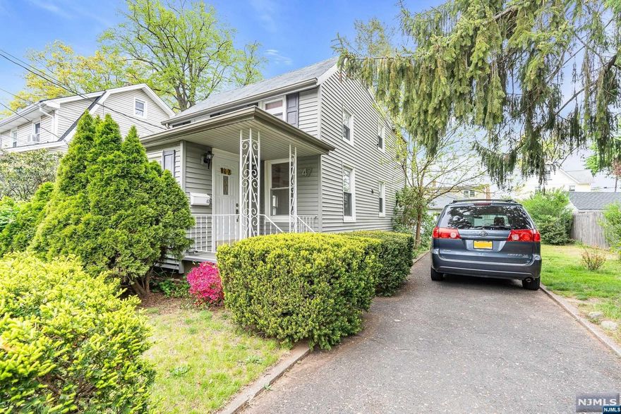 Welcome to 47 Levitt Ave, Bergenfield, NJ! This home serves comfort. Inside, you'll find 3 bedrooms and 1 full bathroom with hardwood floors. The kitchen has fancy limestone walls and floors, plus a granite countertop for cooking and chatting. The bathroom is a peaceful place, with smooth travertine walls and floors for relaxing showers. Clean and maintained basement serves your storage needs. Outside, enjoy the welcoming porch, walkway, and patio with cool porcelain tiles for fun times with friends. The fenced backyard is a private paradise, featuring an artificial grass playground for easy, year-round outdoor fun. Don't miss the opportunity to make this one your first home! Best and Final Offers 5/13 5:00pm