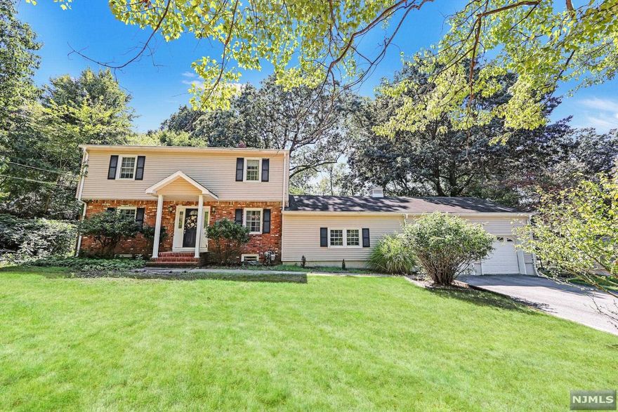 Your Peaceful Escape in the Suburbs...The finest of quality meets serenity at 659 Cobh Rd., a beautifully maintained home set on a half-acre of lushly landscaped private grounds in desirable location. This special home accommodates grand entertaining and comfortable daily living with grace and ease. Impressive front-to-back living rm featuring hardwood floors and sunfilled windows. Leads nicely to the modern Eat-in Kitchen w/granite counters & SS applcs, and sunny breakfast area overlooking spectacular tranquil rear yard. Kitchen flows nicely to the formal dining Rm & expansive family rm featuring vaulted ceilings, sun-filled windows & rear yard access. A convenient Bedroom or Home Office and pretty powder room complete main level. The Upper Lvl is host to a beautiful primary suite w/hardwd floors,FBath, WIC and 2 addt'l spacious bedrms plus renovated full hall bath. The part finished lowerlvl awaits your finishes. FAB Town with TOP RATED schools, close to shopping & NYC Trans!