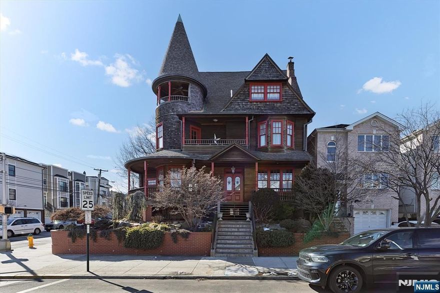The Queen of Harrison. This iconic Victorian, built in 1896 has only had 4 owners and is now available for the fifth. Sitting on a corner lot with a detached 2 car garage, English garden and brick retaining wall, this house is well known to anyone that has ever been on Davis Ave. With five floors and a total of 5,440 sqft of living space consisting of a balanced blend of original details and modern touches, this house has it all. On the first floor there is an office, mudroom, parlor, dining room, large sunny eat-in-kitchen & a half bath. The second floor has a Primary bedroom w/ full bath, 3 bedrooms, a 2nd full bath & a balcony. The third floor contains an exceptional entertaining room that boasts a turret balcony and stunning view of NYC. In addition, there is a wet bar and a full bath. A spiral Staircase leads to the 5th bedroom on the fourth floor. In the full finished basement, there is the 2nd full kitchen and the 2nd wet bar, along w/ full bath and laundry room.