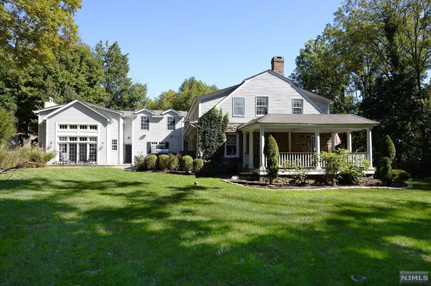 The allure of this home is the uniqueness with a mix of old world charm & new sophistication for today's lifestyle. The authentic handsome LR, billiard rm, sitting rm, private office, large windows, french doors, outdoor rear covered living rm. The renovation of approx. 2006 includes the focal point of the home...the kitchen in the center of the home with in-set cabinetry, granite, high end appliances, double wall ovens, island w/built-in display cabinets, built-in handsome desk, brkfast rm w/wall of french doors leads to courtyard, open two sty great rm w/wall of glass, fireplace & 2nd staircase. Mudd rm, PR, open staircase to lower level w/rec rm, gym, & plenty of closets. Retreat upstairs to the primary bedroom w/spa bath, balcony, ensuite bedroom, three addt'l bedrooms, 2 addt'l baths, huge laundry rm. Outdoor oasis: privacy abounds, gunite fenced pool w/paver patio, front & rear courtyard, porch, so much open space. Radiant heat, 3 frpl, blue stone patio & much more