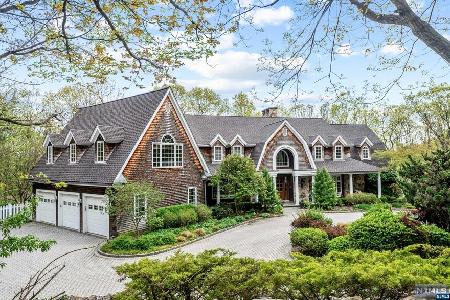 Spectacular Hamptons style estate nestled in ultra-peaceful location inside The Polo Club in Mahwah. Drive over a one lane bridge and up a long winding driveway to this private retreat that sits atop 6.5 acres on the Ramapo Mountains, offering breathtaking views & privacy. This is a very special property that doesn't come on the market often. Resort-style living with luxurious amenities & tranquil setting. Beautiful architectural details evident inside & out. Grand 2 story foyer welcomes you. Amazing 2 story great room with wall of windows & FP. Gorgeous chef's gourmet kitchen. Generously sized bedrooms. Primary Suite offers sitting room, spa-like bathroom, & WIC. Fully finished basement with 2 gyms, theater & huge rec spaces. Outdoor oasis with pool, firepits, outdoor kitchen. For the ultimate car enthusiast, 3 car attached garage & 2 car detached structure w. bonus office/loft above. Too many details to list. One-of-a-kind estate for sophisticated living amidst natural splendor.