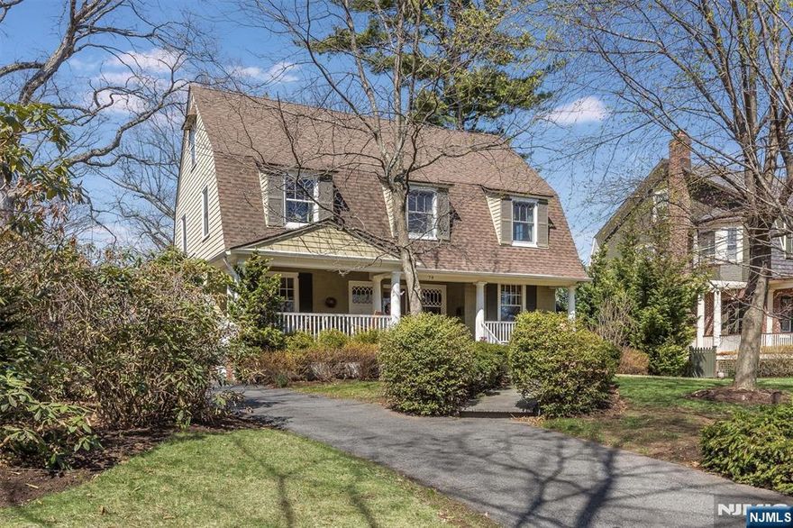 This stunning east-west-facing farmhouse blends historic charm with modern comfort, set on a picturesque street with Belgian block curbs and sunrise-to-sunset views. Traditional elegance greets you at the front porch and carries throughout the home's architectural details. Inside, a spacious layout includes LR, DR, sunken FR, sunlit eat-in kitchen with deck access, and a dedicated office ideal for remote work. Three fireplaces on the main floor add cozy ambiance. Upstairs, the expansive 2nd floor offers a luxurious primary suite with sitting area, four additional BR's, and two full baths perfect for guests. The 3rd floor adds versatility with two more BR's and storage. A partially finished basement features play area, dart room, pool room, and workshop. Outside, enjoy a detached 2-car garage, tool shed with deck, and a pergola overlooking the large backyard, ideal for entertaining or quiet evenings. Located in a sought after neighborhood with top rated schools and easy NYC access.