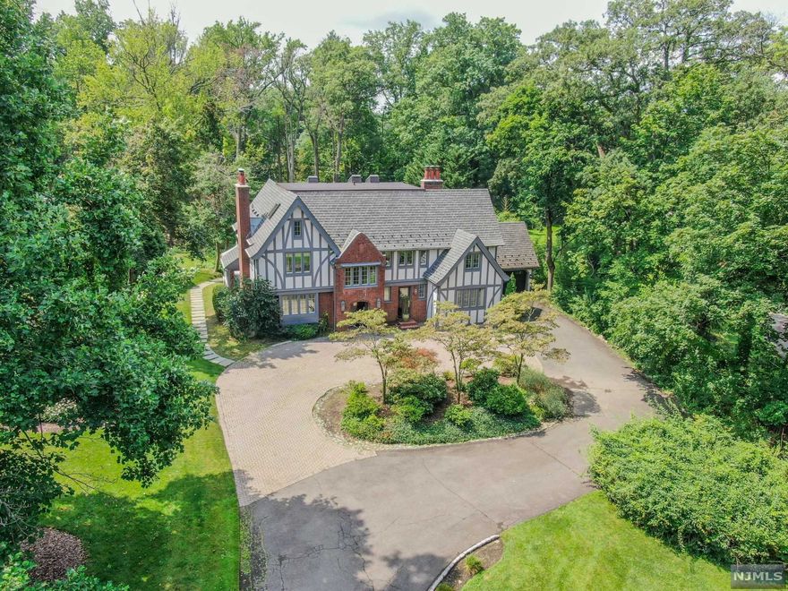 Welcome to 226 Chestnut Street... This magnificent home sits on approximately one acre of flat, park-like property within close proximity to houses of worship in the sought after East Hill of Englewood, NJ. Suburban living at its best and located only minutes from Manhattan, this 5 bedroom, 4 full and 1 half bath home has it all! Enter through the grand foyer straight into an elegant formal living room with fireplace. The massive eat-in chef's kitchen is equipped with two refrigerators, two dishwashers, 2 sinks and ample counter space. The main floor also features an oversized dining room, butler's pantry, den/family room, light filled office/sunroom and 2 car attached garage. Upstairs you will find the luxurious primary suite with a spa-like bathroom and walk in closet. 3 bedrooms and 2 additional bathrooms complete this floor. The third floor features an oversized bonus room/playroom, bedroom & full bath.