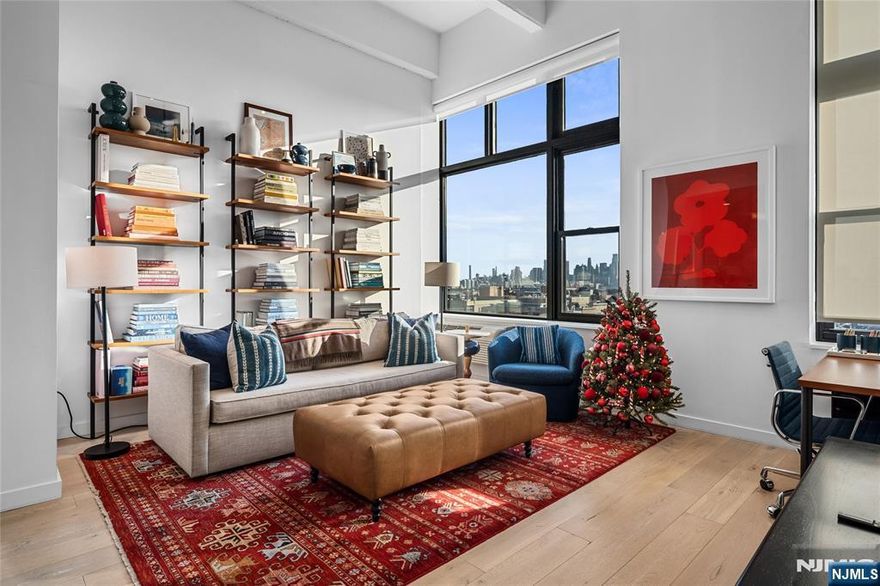 Welcome to Residence 11P at the iconic Hudson Tea â€” a bright, south-facing true one-bedroom with soaring 14-foot ceilings and open New York City skyline views, including the Freedom Tower. Spanning 755 square feet, this beautifully upgraded home blends historic loft character with modern finishes and an effortless uptown lifestyle. The open layout features light oak wide-plank floors, oversized windows, and incredible natural light. The kitchen is outfitted with espresso cabinetry, full granite counters, stainless steel appliances, and a sleek backsplash. The spacious bedroom enjoys NYC views and includes a custom walk-in closet with built-ins. Additional comforts include full-size washer/dryer, abundant hallway storage, and an oversized crawl space for seasonal items. Hudson Tea amenities include a 24-hour doorman, on-site gym, resident lounge, childrenâ€™s playroom, and shuttle to the PATH. Perfectly located along the uptown waterfront near the ferry to NYC, shops, cafe's, parks, schools, and dining. One covered garage parking space is included in nearby garage with a $140/mo HOA.