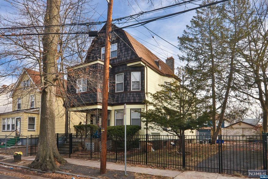 2 family, detached home in the heart of Essex County. Possible 4th unit but must be confirmed with the city. Partially finished basement that contains one room and one full bath. New windows, roof, siding and hot water heaters. Hardwood floors throughout the home and beautiful bay window in the front first floor room. Double lot, detached garage which is in need of repair but is fitted with electric. Wrought iron fencing and mature landscaping. Near shopping and major roads. Walking distance to neighborhood parks and eateries. Excellent investment opportunity.