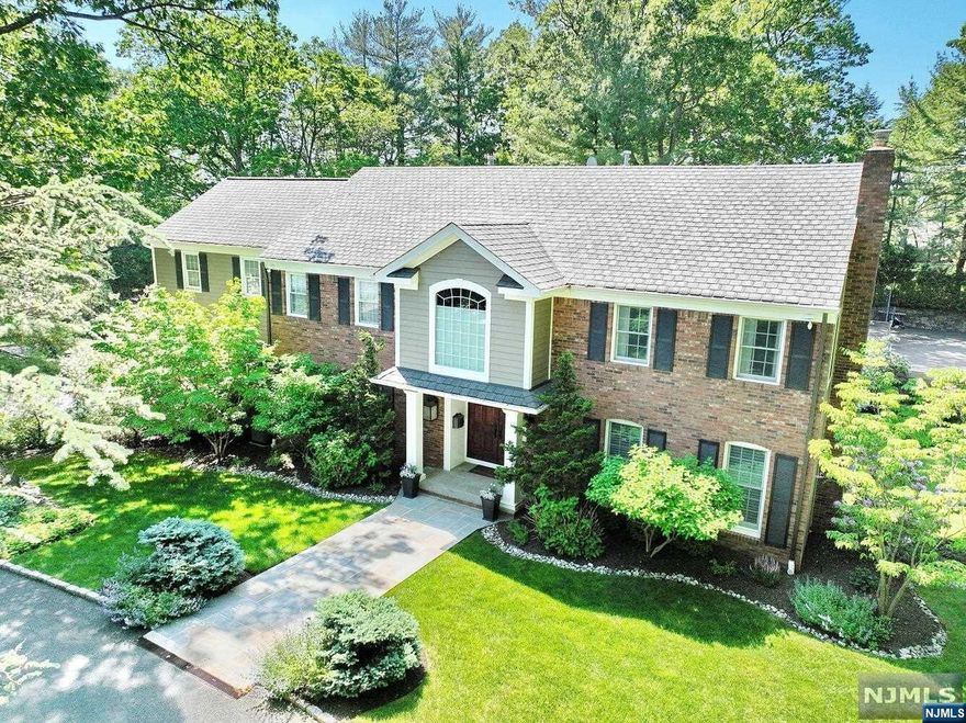 ELEGANT CENTER HALL COLONIAL W/CIRCULAR DRIEWAY ON BEAUTIFULLY LANDSCAPED CORNER LOTW/MATURE LUSH ACRE+ OF PRIVACY AND TRANQUILITY. LOCATED ON PRESTIGIOUS EAST HILL OF CRESSKILL, THIS 5/6 BR & 7BA HOME OFFERS FINE CRAFTSMANSHIP & DETAILS THROUGHOUT. SPACIOUS LIVING W/FIREPLACE, FORMAL DINING W/COFFERED CEILING, WOOD PANELED OFFICE W/FIREPLACE GOURMET KITCHEN W/LARGE PANTRY BREAKFAST AREA & FAMILY ROOM GUEST BEDROOM ENSUITE W/STUDY/SITTING ROOM 2ND LEVEL OFFERS A PRIMARY SUITE W/VAULTED CEILING, MARBLE BATH & LARGE CUSTOM CLOSET (WAS A 4TH BEDROOM), 2 ADDITIONAL BEDROOMS & 2 FULL BATHS, & INDOOR BASKETBALL W/ LOFT. WALK-OUT LOWER LEVEL FEATURES MEDIA ROOM, REC ROOM W/BAR, BEDROOM ENSUITE & 1/2 BATH. EXTENSIVE /CUSTOM STORAGE THROUGHOUT. 3 CAR GARAGE. HOUSE GENERATOR, SALTWATER POOL, TENNIS/PICKLEBALL COURT. JUST A SHORT DISTANCE FROM NYC. GREAT SCHOOLS. Liz Ruckdeschel Coldwell Banker MORE DETAILS 201-522-4020