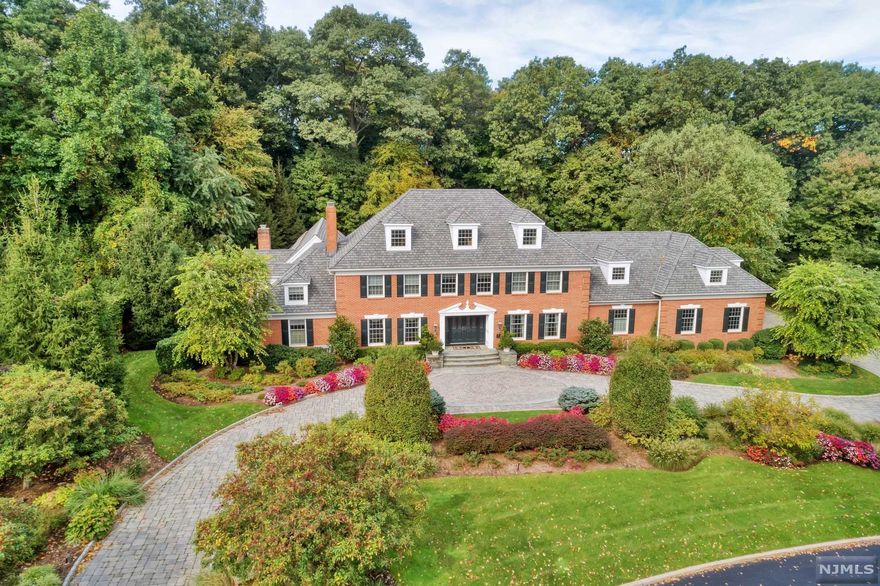 This rare find, boasting 6 bedrooms and 7 baths is the perfect family home. It provides the full package, including new-age "working from home" amenities such as a fabulous theater, full bar with card room, billiards room, wine cellar and gym. It also dons one of the best award-winning indoor pools you have ever seen, with a hot tub and waterfall! The Main Floor features a custom built Peter Salerno Kitchen with brand New 48" Wolf stove and egress to a quiet backyard and deck. Vaulted ceilings in the Great Room and a formal living room with one of the homes 4 fireplaces. Too many amenities to list-it's a MUST SEE home!