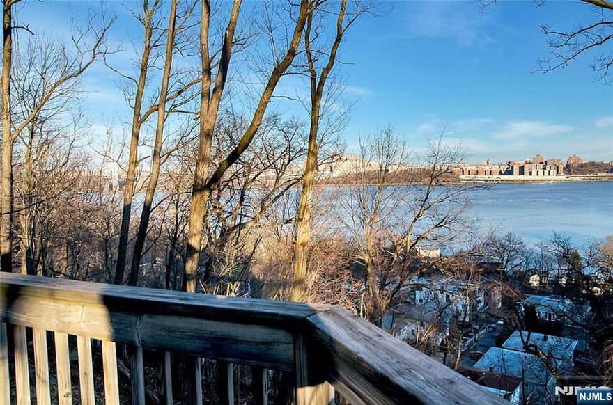 Totally secluded private oasis with full Hudson River views.Views from the living room, primary bedroom,huge bluestone patio, and wrap around 3rd level deck. Spectacular and expansive artist's loft with sliding doors facing east to the Hudson and south to downtown NYC view with cathedral ceiling and skylights, hardwood floors, bathroom, darkroom, and access to the deck. Great for artist, musician, writer, photographer, or any creative person with love of natural surroundings. ENDLESS POSSIBILITIES. Entry level living room boasts wall of windows to the Hudson view and surrounding woods, 2 bedrooms, full bathroom and a kitchenette. Lower level-large eat in kitchen, entertaining/dining area, powder rm, laundry, windows with views, and private entry. One mile south of GW Bridge. Property is in Ft Lee and Edgewater. Brand new roof and new oil tank.