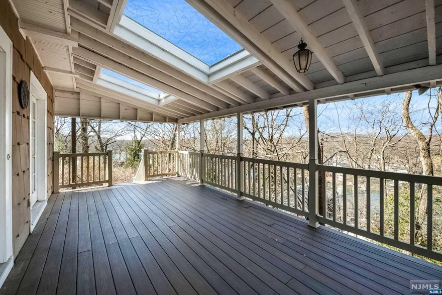Colonial sitting on top with panoramic views of the lake from various rooms in the home.French doors lead out to the trex porch to enjoy lake views and more. Home is close to nature activities, restaurants and major highways.
