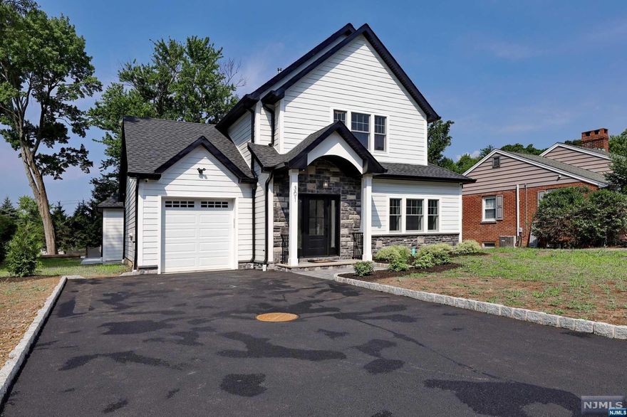 Stunning elegant home in the most desirable Wyckoff NJ with brand new sewer line. Featuring close to 4400 sf of living space, including basement. Enter into an open floor plan including formal dining room, living room with gas fireplace, french door opens to patio, eat-in kitchen with center island and quartz countertops, all appliances, powder room and first floor on suite bedroom with spa-like bathroom. Second floor primary bedroom with primary bathroom, 2 walk -in closets, additional 2 bedrooms, full bathroom and laundry. The finished basement adds another dimension to the home with rec room with gas fireplace along with an office, gym, full bath, storage room, laundry room, utilities, access to backyard. Easy access to shops, parks and NYC transportation. Owner holds RE license.