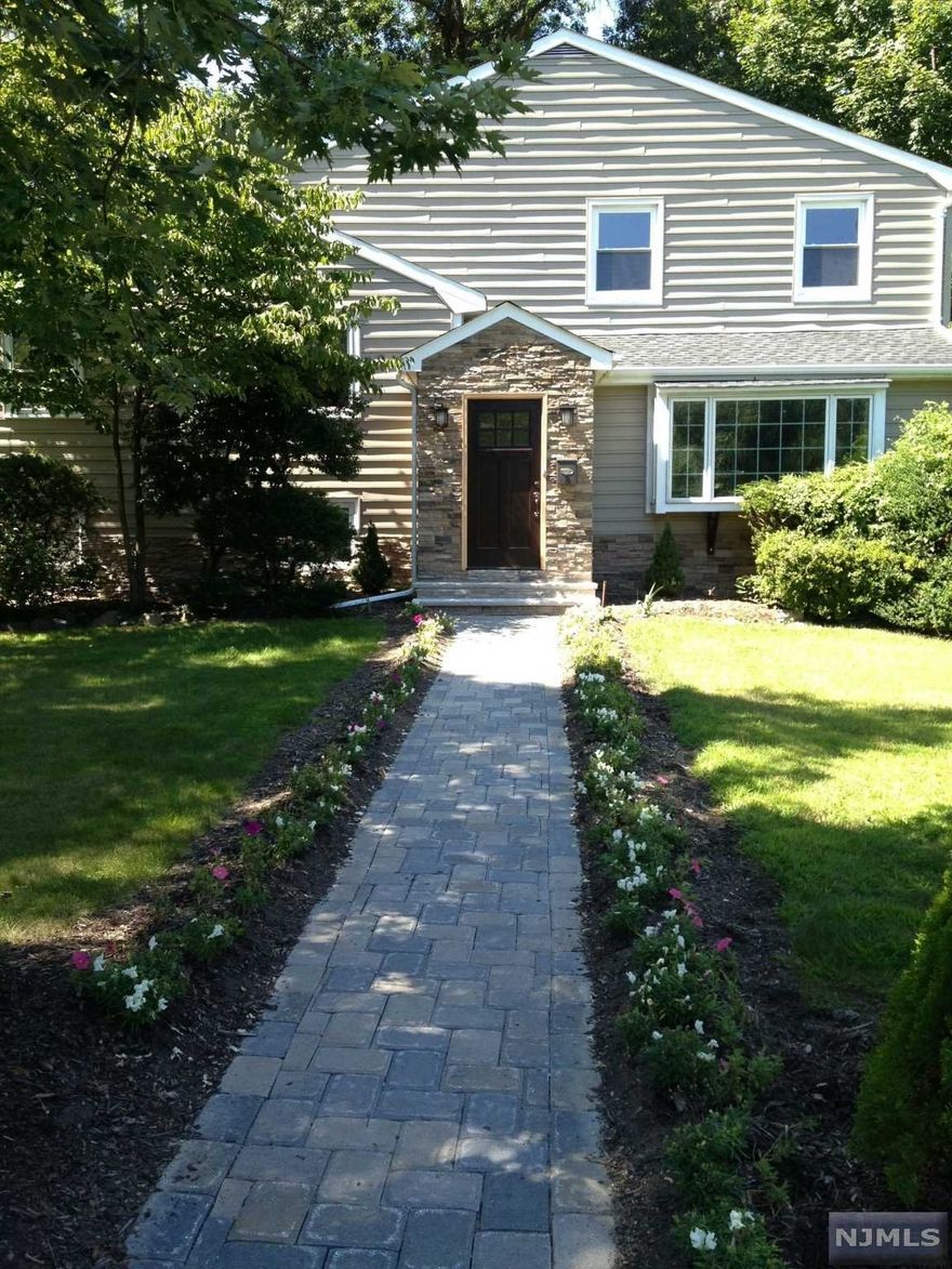 Welcome home to this beautiful home on one of the most beautiful cul-de-sacs in Closter. First floor features an open foyer into the living room and gourmet kitchen with stainless steel appliances and guest bath. Dining room area with access to the backyard patio. The second floor features three bedrooms and a full bath. Third level opens up to a private master bedroom with master closet and balcony overlooking the backyard. Newer water heater, electrical has been updated, brand new central vacuum, California closets throughout, brand new 2 car garage (tiled), updated light fixtures and so much more. Home is being sold as is. You won't want to miss this gem! Walking distance to Ruckman park.