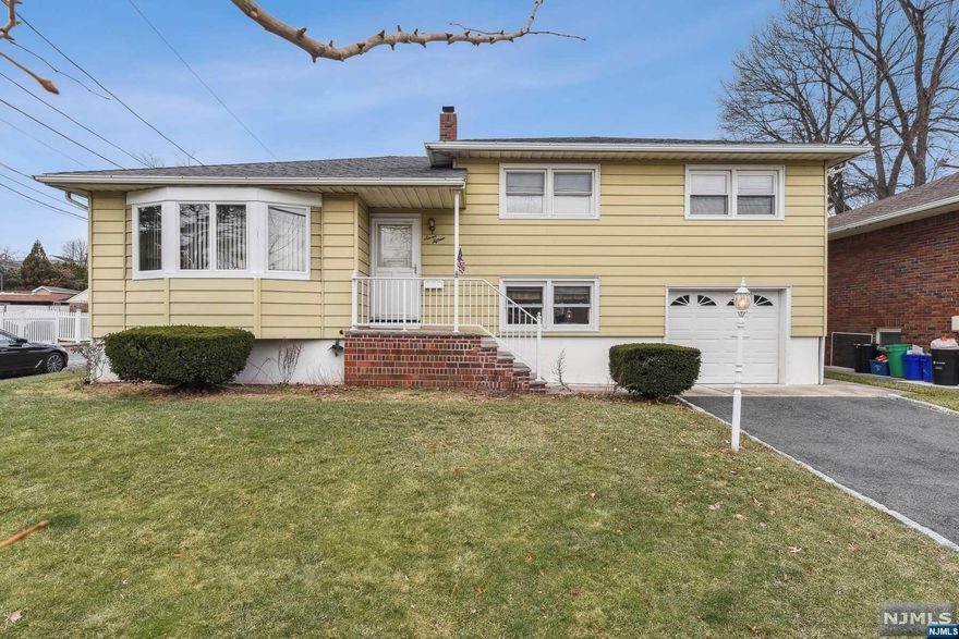 Large 3 bedroom, 2.5 bath split level home located in residential area. Formal Living Room and Dining Room, Eat in Kitchen, and Family room. A well-manicured level corner lot. All Hardwood floors, Central Air, Large Cedar closets throughout. One car attached garage with a Belgium block lined driveway. Attic storage, Newer Cambridge Stone back steps. Laundry room and full unfinished basement with heat. Newer hot water heater from 2020. Centrally located near schools, shopping, Dining, parks, and NYC transportation.