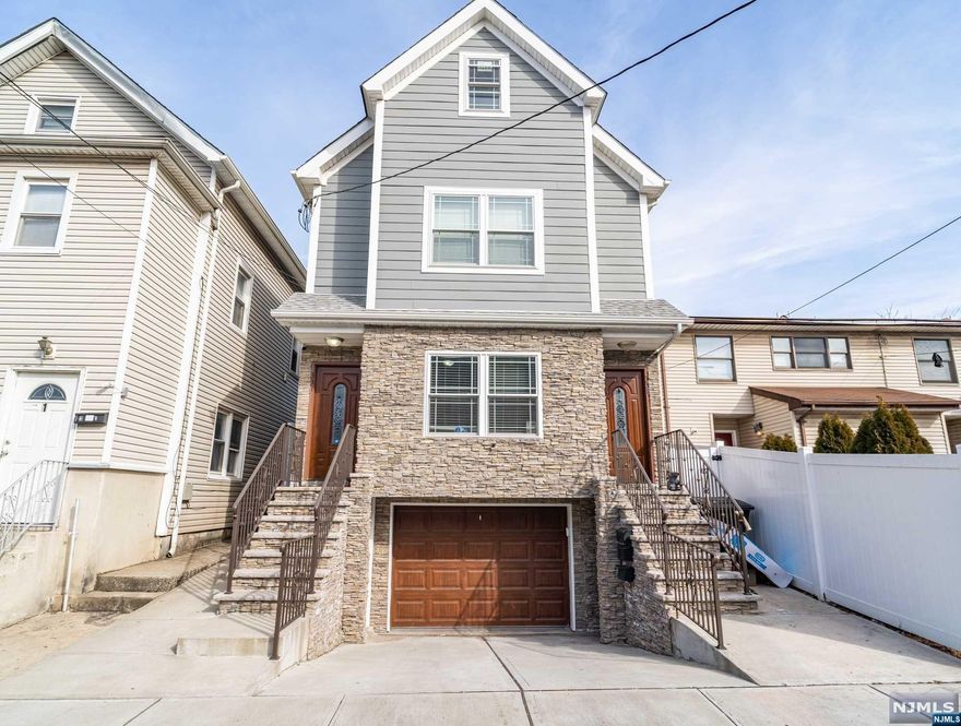 Your search ends here! UNIQUE newer construction 2 family home with an additional single family in the back. TWO houses for the price of one. There is truly nothing like it. No expense was spared in this home. Open concept living areas, central air/heat, gorgeous hardwood floors throughout. New ferry in Elizabeth has been approved and will be coming as soon as this summer, making Elizabeth a commuter's dream. Come turn this house into your home!