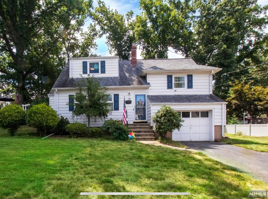 Showings begin Sunday 9/25. Nestled in Dumont's most desired neighborhood, this move-in ready home features an easy living floorpan with a welcoming ambiance. A sun-drenched dining room with hardwood floors invites you as you enter and opens to the living room with large bay window overlooking the backyard. Eat-in kitchen with stainless steel appliances and sliding glass doors open to large deck overlooking your sprawling backyard, perfect to entertain and create many delightful memories. Ground-floor features an office space and half bath with separate entrance that leads to a finished basement that currently serves as a recreation room. One-car attached garage. Central A/C. Cheerful suburban living awaits you here! Recent upgrades include: kitchen appliances, washer/dryer, newer roof, updated full bath. Close to NYC transportation, shopping, schools, parks & houses of worship. Contact Listing Specialist, Kristie Davida at 201-968-7239