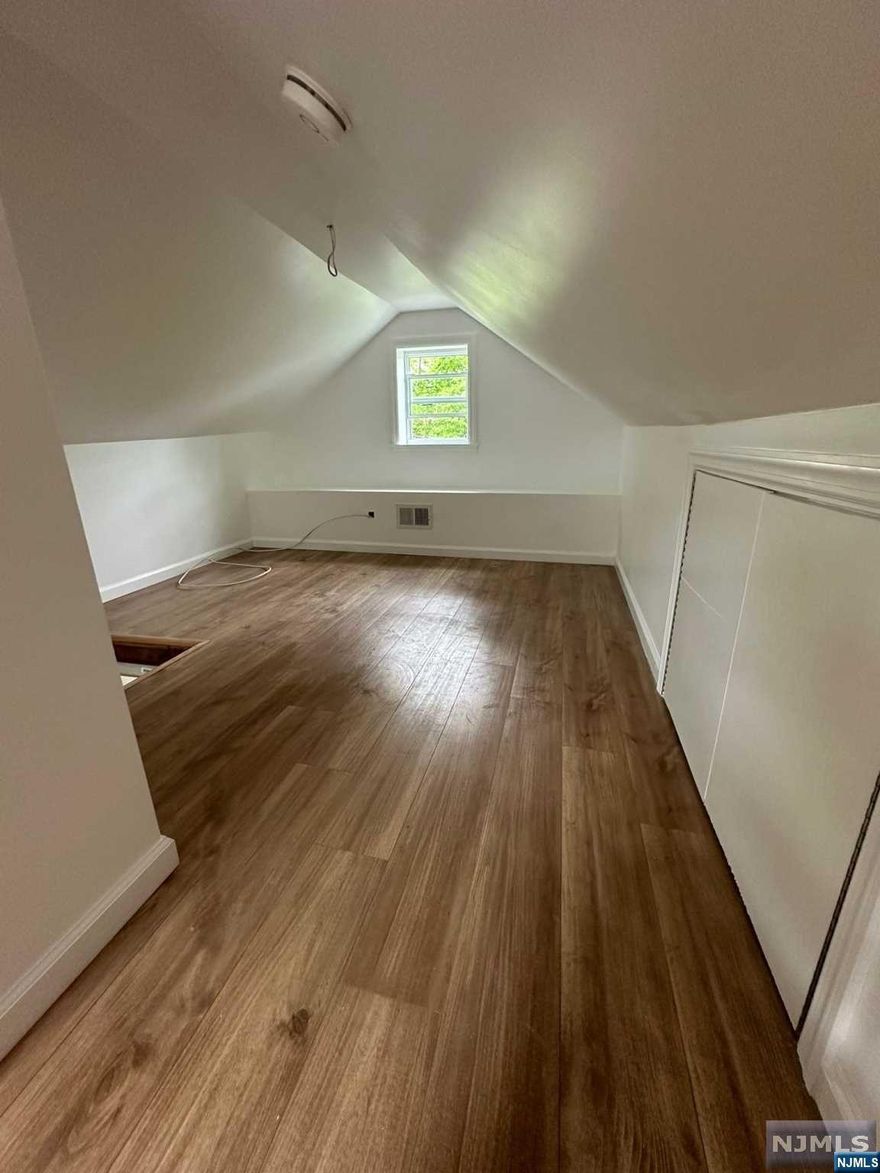 Not in a Flood Zone! Super low taxes! This 2 bed, one bath finished attic home has been fully renovated down to the studs including new electrical and new plumbing. Fully equipped kitchen ready with All smart samsung appliances: gas stove with built in Air Fryer, microwave, refrigerator and Dishwasher. Kitchen island which opens out to the dining room area. Smart LG washer and dryer for all your laundry needs. The bathroom is equipped with relaxing rain shower faucets, LED exhaust with Bluetooth speaker and LED anti fog mirror. Over 15 windows throughout floods in natural lighting. Central A/C and Heat. Woodburning fireplace. Enjoy summer days on the deck off the living room sliding patio doors with views of the Lake Partial unfinished basement. Large Lot, driveway parking for up to 4 cars! Shed afor storage! Schedule your private showing today! walking distance to eeverything: shopping plaza, dispensary, post office, cityhall, library, banks, pharmacy. Professional photos soon!