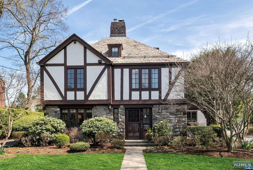 Presenting an extraordinary offering in Ho-Ho-Kus' sought-after Cheelcroft neighborhood. This original, well-preserved, Cheelcroft home is a testament to exceptional architecture and meticulous attention to detail. With 5 BDR and 3.5 BTH, the home provides spacious and comfortable living. The 1st flr offers a thoughtfully designed layout, including a LR w/a stunning fireplace, a spacious FR, FDR, well-appointed EIK w/a convenient counter bar, a home office and PR. Upstairs you'll find 4 generously sized bedrooms, including a luxurious primary suite complete w/private FB and a balcony that overlooks the serene backyard. Conveniently located in the hall is a combined LR/FB. The 3rd flr includes a private 5th BDR complete w/FB. The finished basement w/fireplace and kitchenette offers the perfect rec space. Step outside to find a private, beautifully landscaped backyard and oversized garage w/loft. Don't miss the chance to own a piece of Ho-Ho-Kus' architectural legacy!